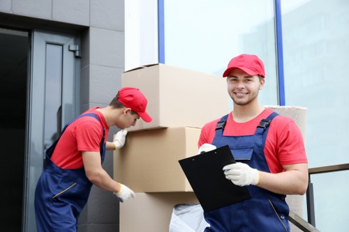 Office removals planning in Mitcham with moving boxes and workstation setup